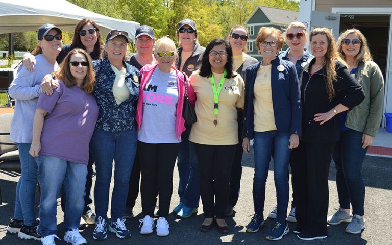 a group of women posing outdoors